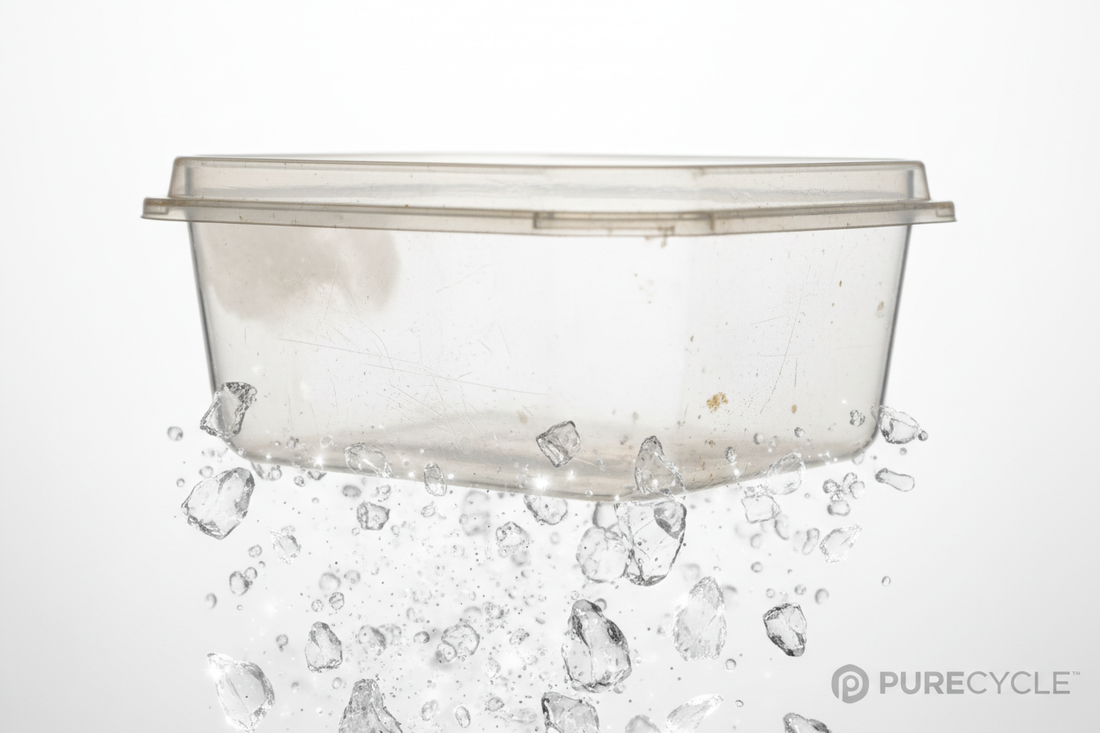 Worn plastic food container releasing microscopic microplastic particles into food